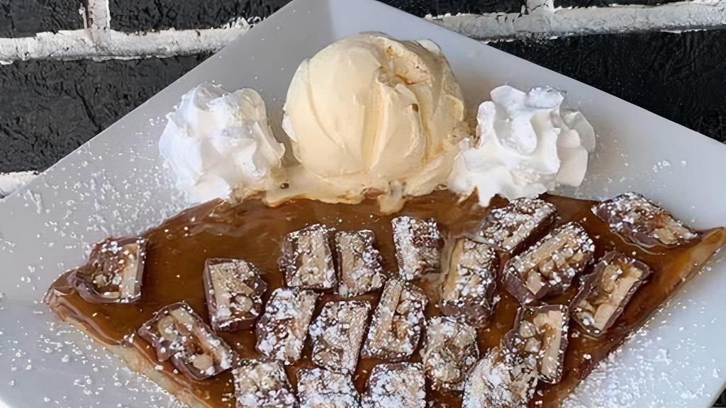 Liquid Gold Crepe · A golden combination of our Dulce de Leche sauce and pieces of Snickers®.  Includes whipped cream and one scoop of either vanilla, chocolate, or strawberry ice cream.