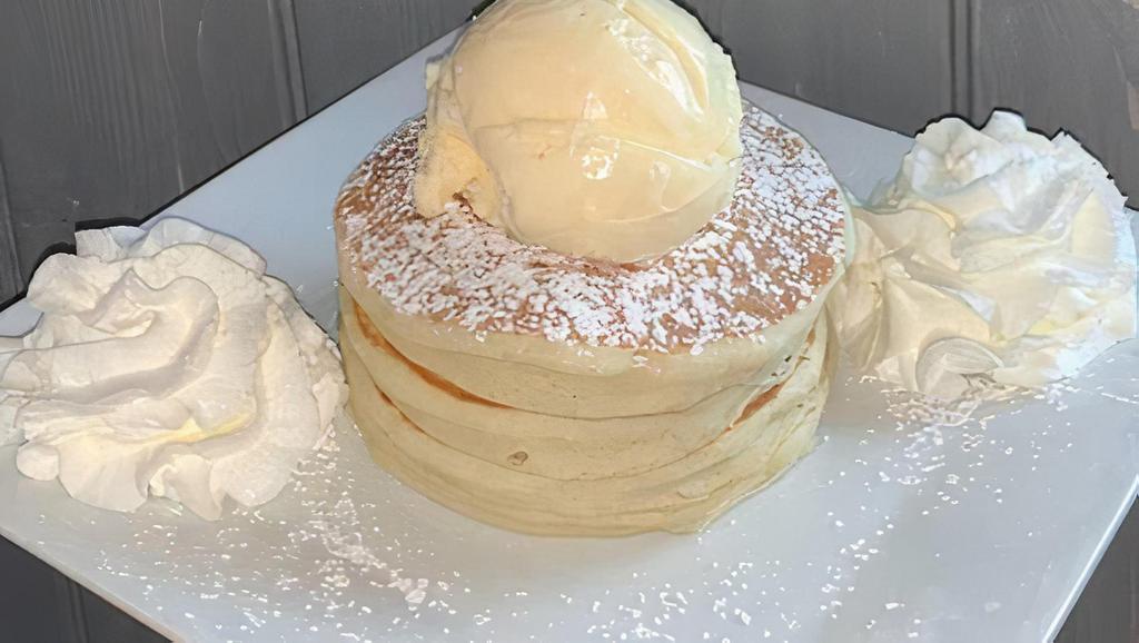 Plain Pancakes · A stack of our homemade pancakes, dusted with powdered sugar.  Comes topped with whipped cream and one scoop of either vanilla, chocolate, or strawberry ice cream!