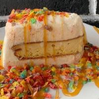 Fruity Pebbles ® Ice Cream Cake · A rainbow delight; our Fruity Pebbles ® ice cream paired with vanilla cake.  Comes topped wi...