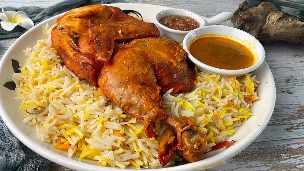 Chicken Over Rice · Rice platter served with fresh chicken, lettuce, and tomatoes. Comes with white and hot sauces.