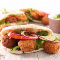 Falafel Sandwich With Fries · Homemade pita bread filled with delicious falafel, fresh lettuce, tomatoes, and hot and whit...