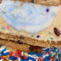 Chubby Sandwich · An ice cream scoop stuffed inside cookie dough squished between choco chip cookies or chocol...