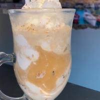 Affogato · A scoop of ice cream topped with espresso shot.