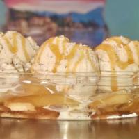 Apple Pie A La Mode · One scoop of apple cinnamon ice cream on top  of a mini apple pie topped with whipped cream ...