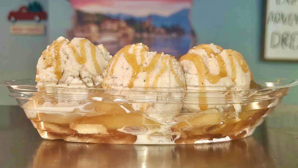 Apple Pie A La Mode · One scoop of apple cinnamon ice cream on top  of a mini apple pie topped with whipped cream and caramel.