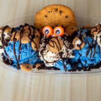 Cookie Monster · Two scoops of cookie monster ice cream with whipped cream, cookie, cookie crisps, crushed Or...