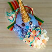 Unicorn Sundae · 1 scoop with chocolate unicorn horn rainbow marshmallows, blue icing & rainbow.