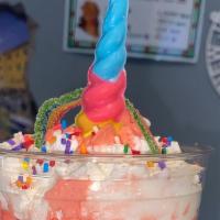 Unicorn Cake Shake · Shake made with rainbow cake w/ rainbow cake sliver and blue icing drizzle around cup, toppe...
