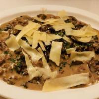 Agnolotti Pulcinella · Homemade half moon shape pasta stuffed with ricotta and spinach in light brown sauce, dutch ...