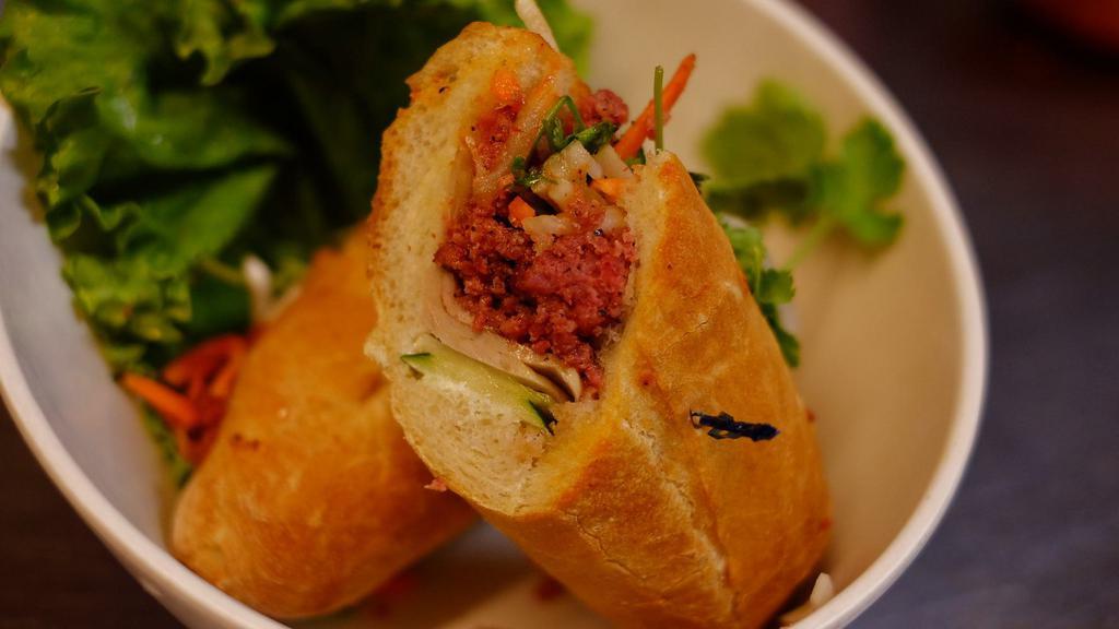 Banh Mi Sandwich · The traditional Vietnamese sandwich with with Vietnamese ham, roasted ground pork, and pate.