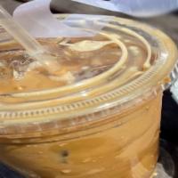 Vietnamese Iced Coffee · Iced coffee drip with condensed milk.