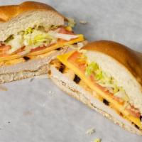 Grilled Chicken Club · Grilled chicken, melted American cheese, lettuce, tomato, and Russian dressing on a club roll.