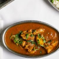 Chicken Vindaloo · Spiced chicken cooked in a sharp and pungent curry sauce.
