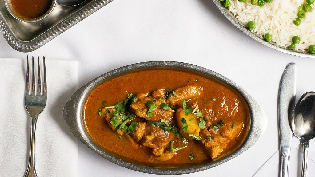 Chicken Vindaloo · Spiced chicken cooked in a sharp and pungent curry sauce.