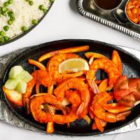 Tandoori Shrimp · Jumbo shrimp marinated in lemon, ginger, and garlic then broiled over mild charcoal heat.