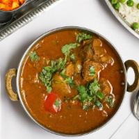 Lamb Korai · Lamb cubes curried in lightly spiced gravy with spring onion, tomato, green peppers, coriand...