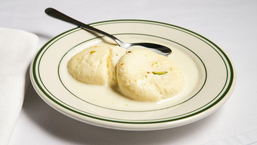 Rasmalai · Homemade cottage cheese, sweetened with condensed milk, flavored with rose water and nuts.