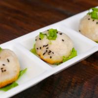 Traditional Shanghai Pan Fried Soup Dumplings (4 Pieces)生煎包 · Hand crafted and steamed.