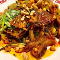 Sichuan Spicy Beef Shank & Tripe · Szechuan style spicy beef, honeycomb tripe, cucumber, crushed peanuts, cilantro, and house m...