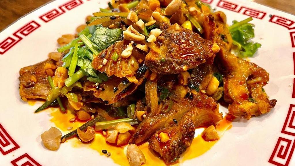 Sichuan Spicy Beef Shank & Tripe · Szechuan style spicy beef, honeycomb tripe, cucumber, crushed peanuts, cilantro, and house made Szechuan peppercorn  chili oil.