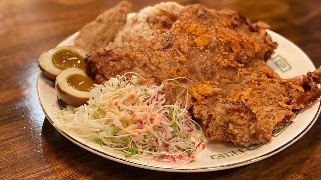 Monster Pork Chop · Giant size of deep fried pork chop packed with secret seasonings. Rice plates come with white rice, a sweetheart egg, braised tofu and veggies
