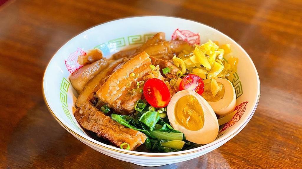 Fooki Belly Bowl · Rice bowl topped with braised thick cut pork belly, pickled mustard, plum tomato, a sweetheart egg, braised tofu and veggies