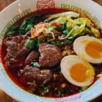 Classic Braised Beef Noodle Soup · (Spicy) Fresh noodle with hearty braised beef broth, topped with beef shank, veggies and a s...