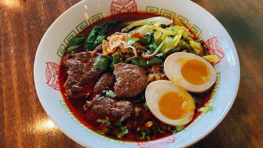 Classic Braised Beef Noodle Soup · (Spicy) Fresh noodle with hearty braised beef broth, topped with beef shank, veggies and a sweetheart egg