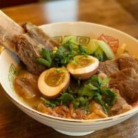 Cowwow Original Noodle Soup · 12hr simmered beef broth cooked with assorted vegetables, 20 spices. Clear beef broth, toppe...