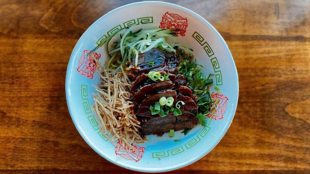 Beef Scallion Noodles · Noodle mixed with fragrant scallion oil soy sauce, topped with braised shanks, fried taro chips, cucumber, red onion, cilantro, parsley, and green onion (No Soup)
