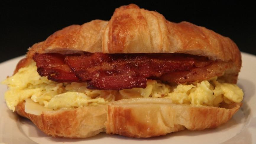 Croissant Breakfast Sandwich · Start with one of our freshly backed croissant, add two eggs any style , crispy bacon, pork roll or sausage make it your own with choice of cheese and all the condiments