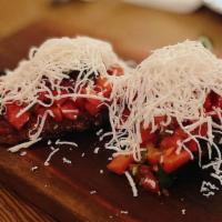 Tomato · With basil, oregano, EVOO, red onion, and ricotta salata.
