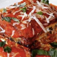 Eggplant Parmigiana · Baked with cheese.