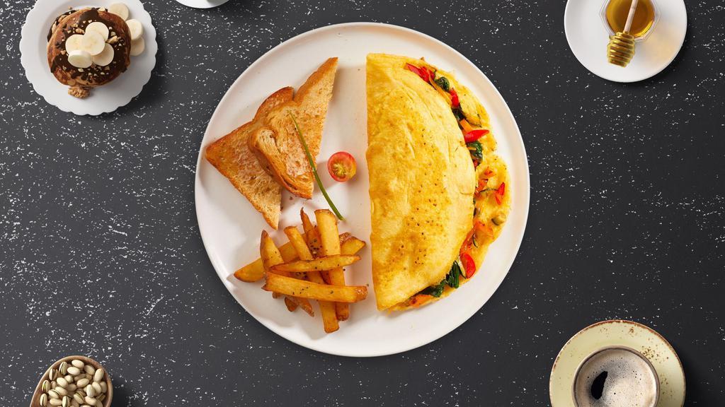 Vegetable Omelette · Eggs, tomatoes, onions, peppers, mushrooms, and broccoli  as an omelette. Served with home fries and toast.