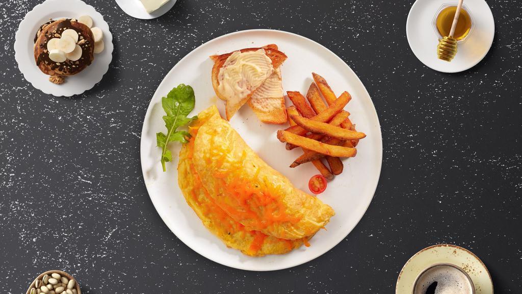 Cheese Omelette · Eggs cooked with melted cheese as an omelette. Served with toast and home fries.