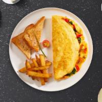 Western Omelette · Eggs cooked with ham, onions, tomatoes, and peppers as an omelette. Served with toast and ho...