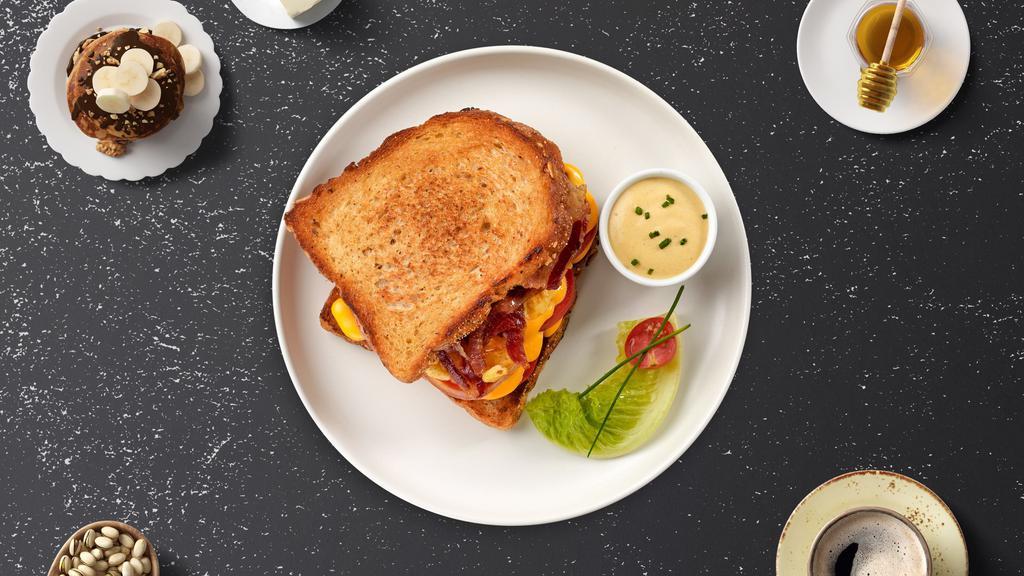 Bacon, Egg & Cheese Sandwich · Scrambled egg, bacon, and cheddar cheese on your choice of bread.