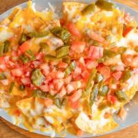 Nachos Con Queso · Cheese, beans, chopped jalapeños, and tomatoes.