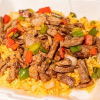 Stephanie Rice  With Grilled Chicken Or Steak · Yellow rice with vegetables.