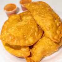 Empanadas · Beef, chicken, rice and beans or ham and cheese.