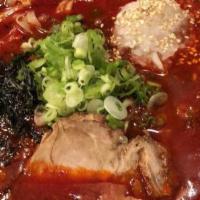 Spicy Shoyu · Spicy soy sauce ramen with chicken broth, cha-shu (pork), scallions, roasted seaweed, onion,...