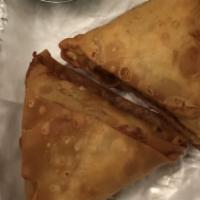 Samosa Vegetable · Crisp turnover filled with mildly spiced potatoes and potatoes and peas. Served with mint an...