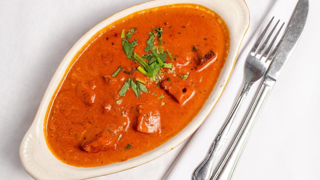 Chicken Tikka Masala · Pieces of chicken tikka cooked in a creamy sauce with fresh tomato and eastern spices.