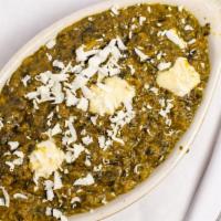 Sag Panir · Spinach and homemade Indian cheese cubes cooked in spices. Vegetarian.