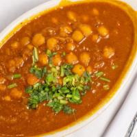 Alo Cchole · Chickpeas and potatoes cooked in mild spices. Vegetarian.