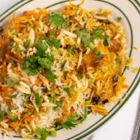 Shahjahani Biryani · Saffron rice cooked with boneless pieces of chicken, cubes of lamb and shrimp.