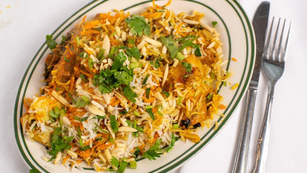 Shahjahani Biryani · Saffron rice cooked with boneless pieces of chicken, cubes of lamb and shrimp.