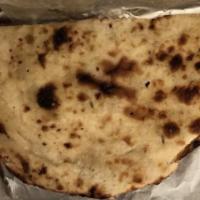 Naan · This traditional teardropped shaped white bread is baked in huge flat ovals by slapping it q...