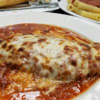 Eggplant Parmigiana · With tomato sauce and melted mozzarella cheese.