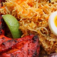 Tandoori Chicken · Tandoori roasted half chicken and served with Basmati Rice